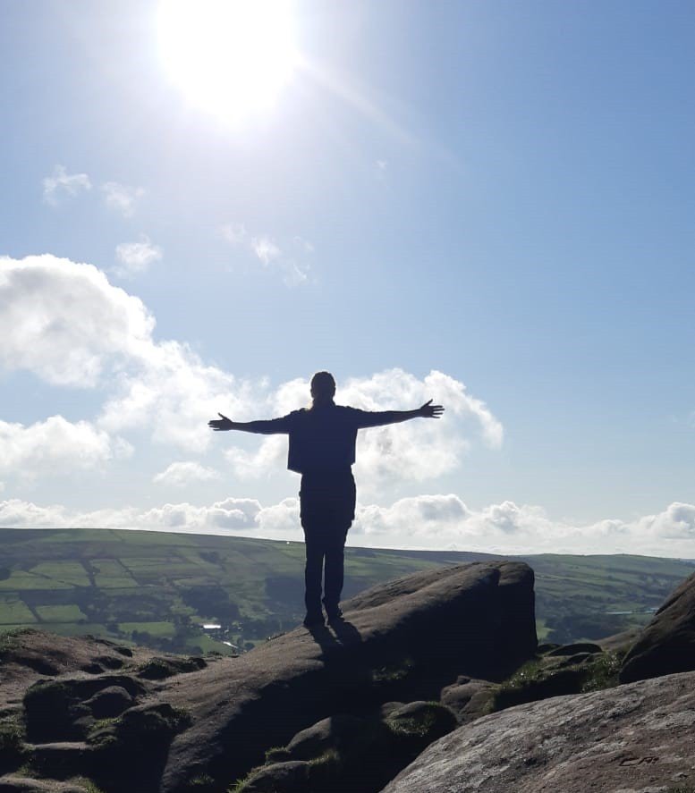 Author B J Kidman standing on top of Hen Cloud