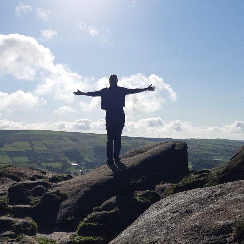 Author B J Kidman standing on top of Hen Cloud